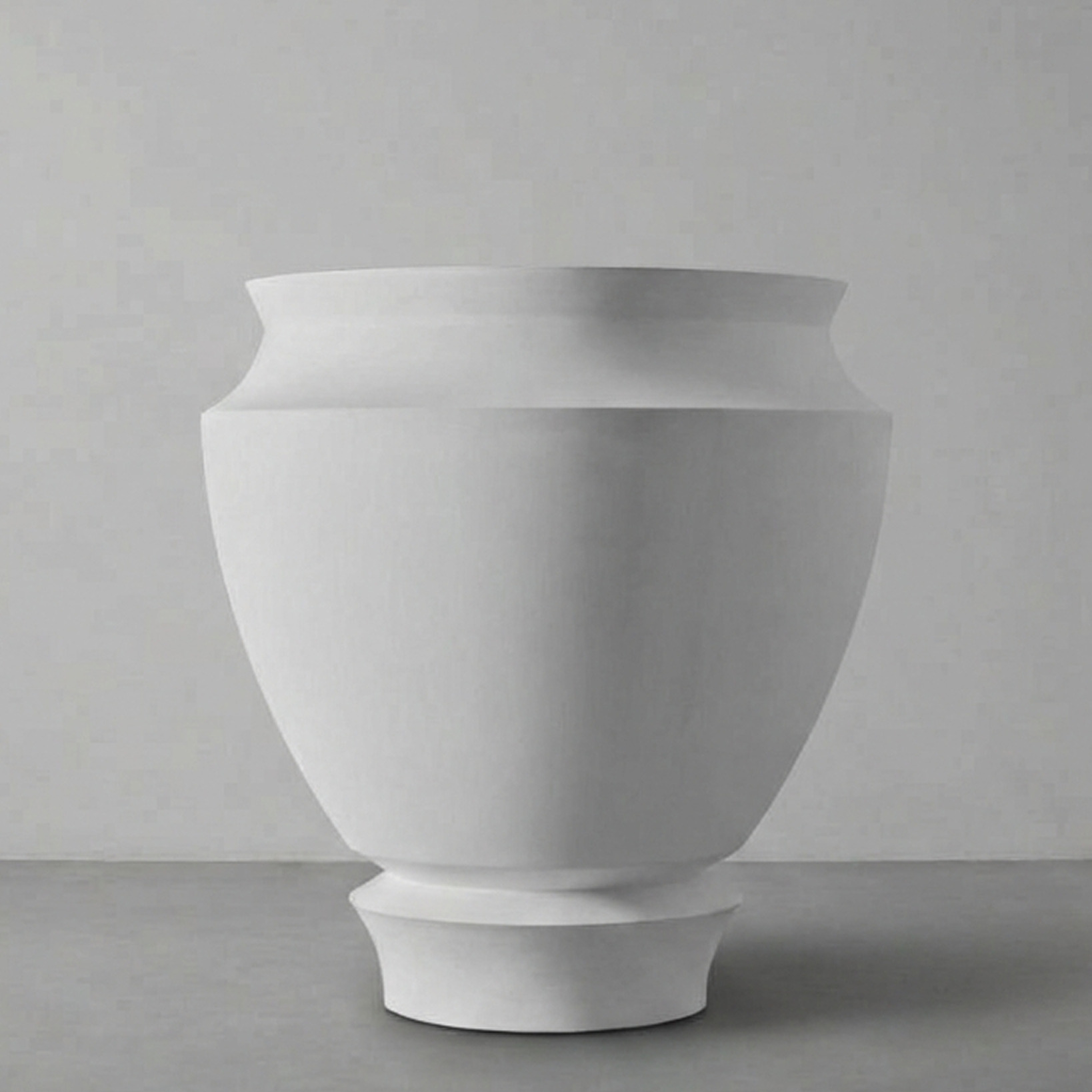 Artifact 04 in Alabaster, a rounded urn, on a grey studio backdrop