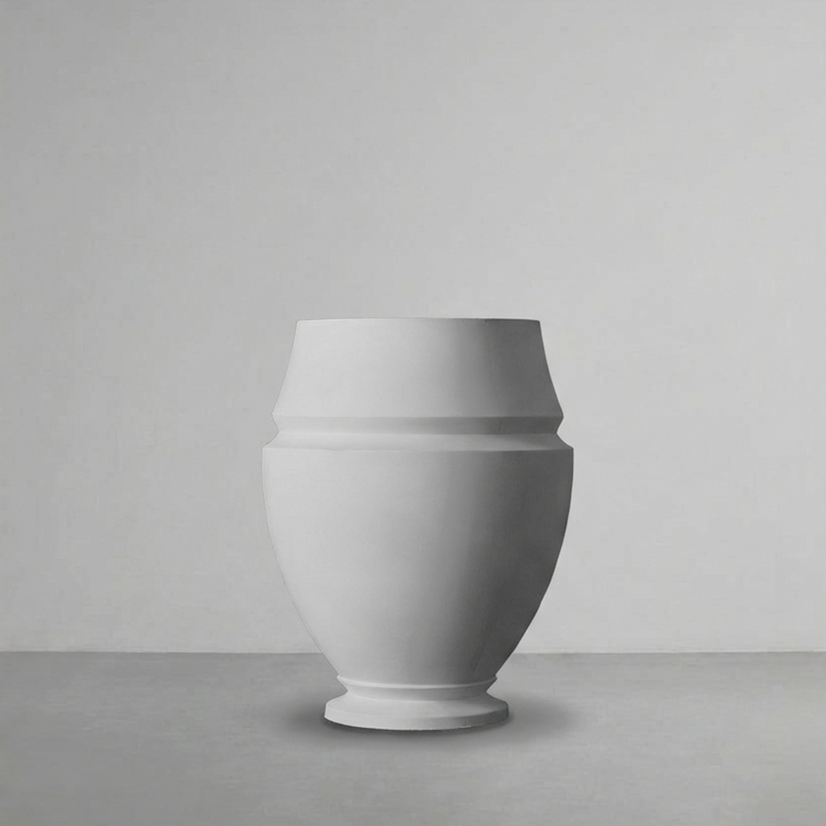 Artifact 05 in Alabaster, a small ovoid urn, on a grey studio backdrop