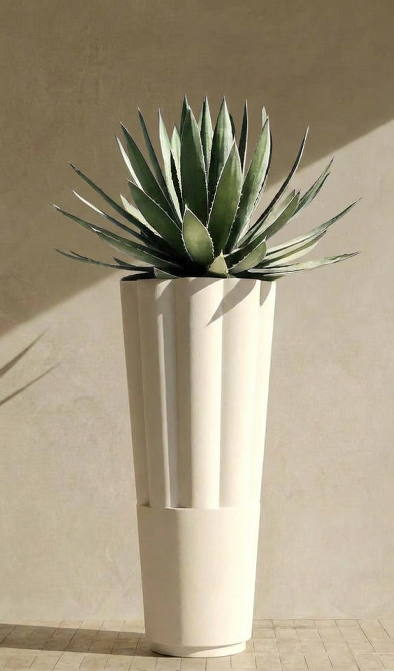 Byblos 03 planted with an agave against a sunlit plaster wall