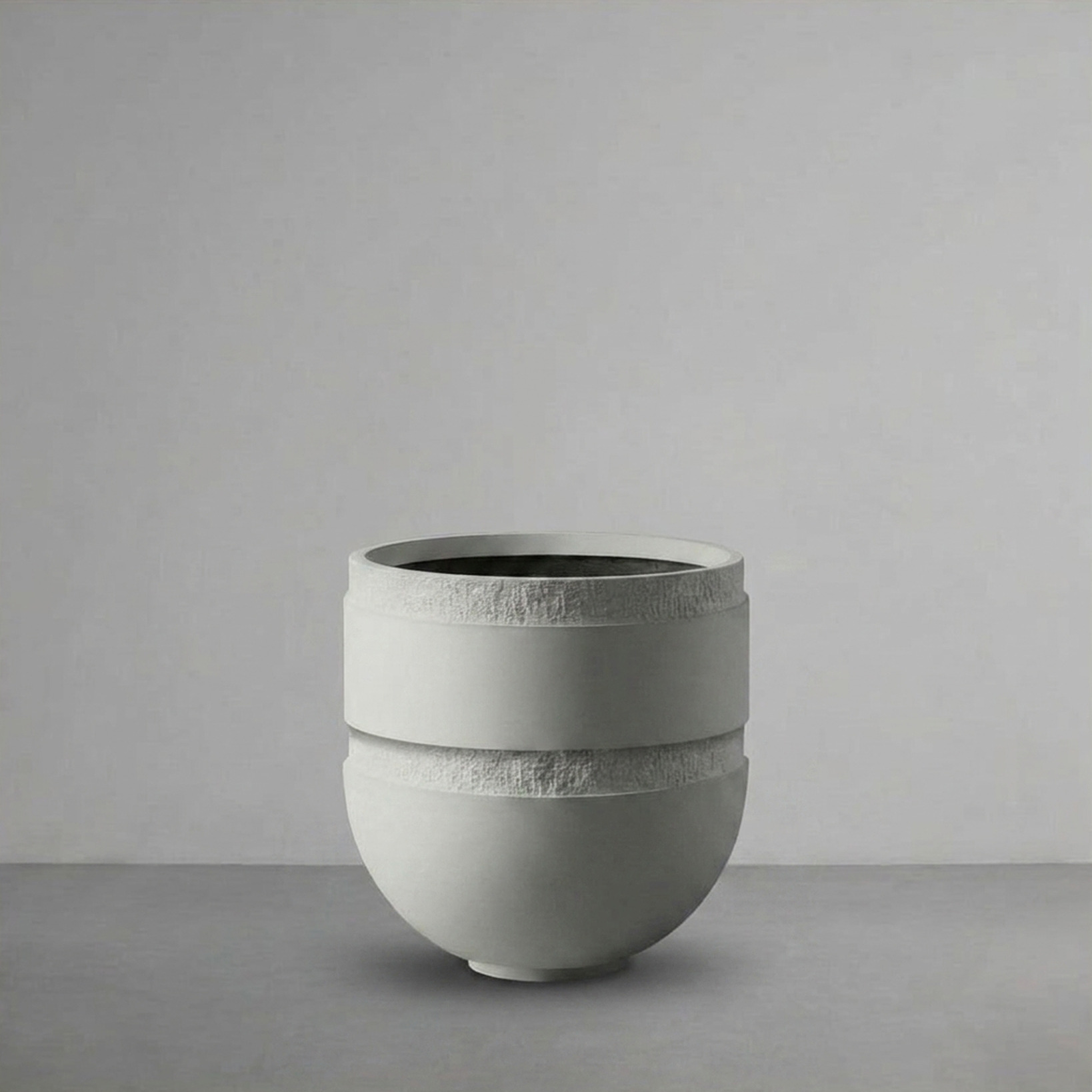 Orion II, a deep round bowl, on a grey studio backdrop